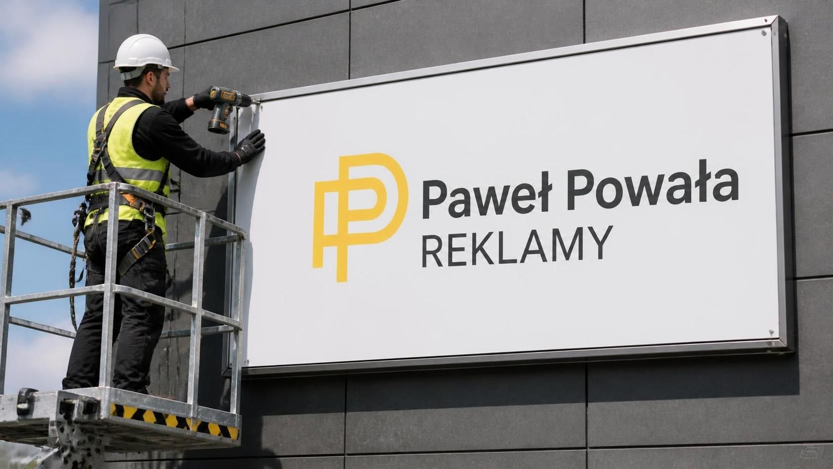 Montaż baneru reklamowego na konstrukcji zewnętrznej